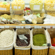 Beans, peas, chickpeas in crates in the supermarket.